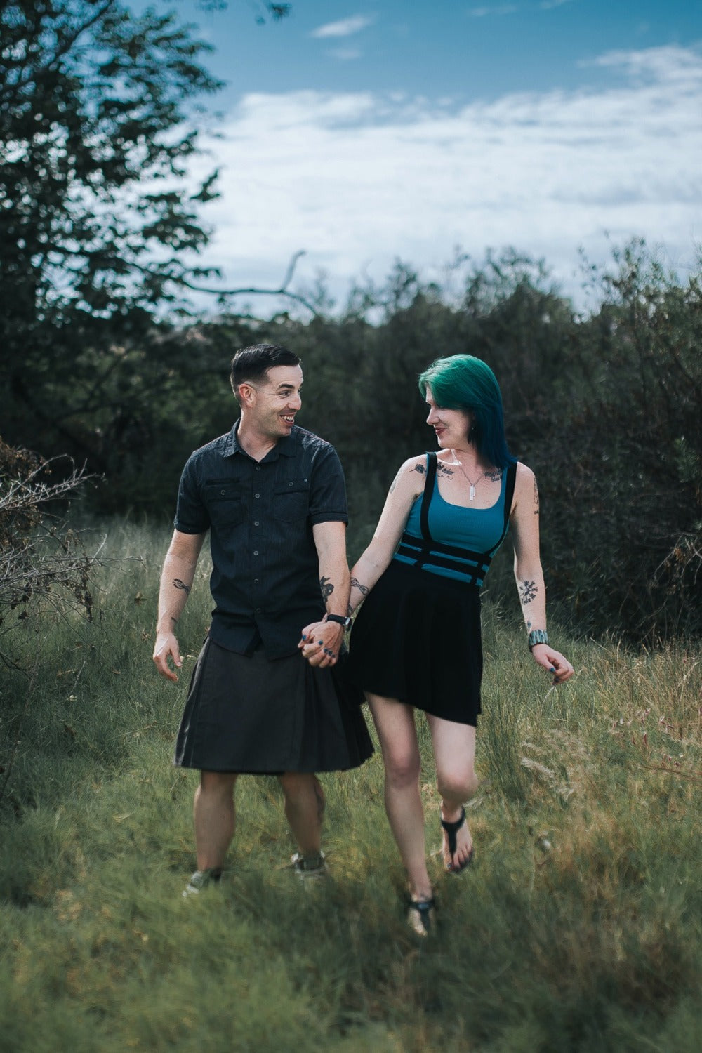 Justin and Ryne Edwards holding hands in a field